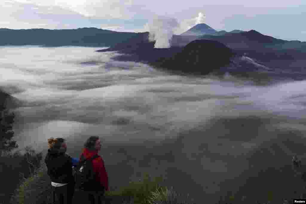 Tourists enjoy a view of Mount Bromo from Penanjakan, Probolinggo, East Java, Indonesia in this photo taken by Antara Foto.