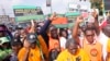 FILE - Labor union members march to protest economic hardship, in Lagos, Nigeria, Feb. 27, 2024. Nigeria's main labor unions agreed on Thursday to a new minimum wage of 70,000 naira ($44) a month after talks with the government.