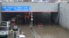 A highway is clogged with water near the Indira Gandhi International Airport after heavy rains in New Delhi, India, June 28, 2024.