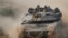 An Israeli tank return from the southern Gaza strip, in southern Israel, Feb. 26, 2024.