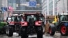 Tractors are stationed in front of the European Parliament during a protest called by farmers' organizations in response to the European Agriculture Council, in Brussels, on Feb. 26, 2024.