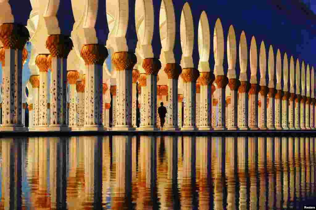 A person arrives for sunset &quot;Maghrib&quot; prayers at the Sheikh Zayed Grand Mosque during the month of Ramadan in Abu Dhabi, United Arab Emirate.
