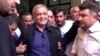 FILE - Iranian presidential candidate, Massoud Pezeshkian walks out of polling station after voting in Tehran, Iran, July 5, 2024. 