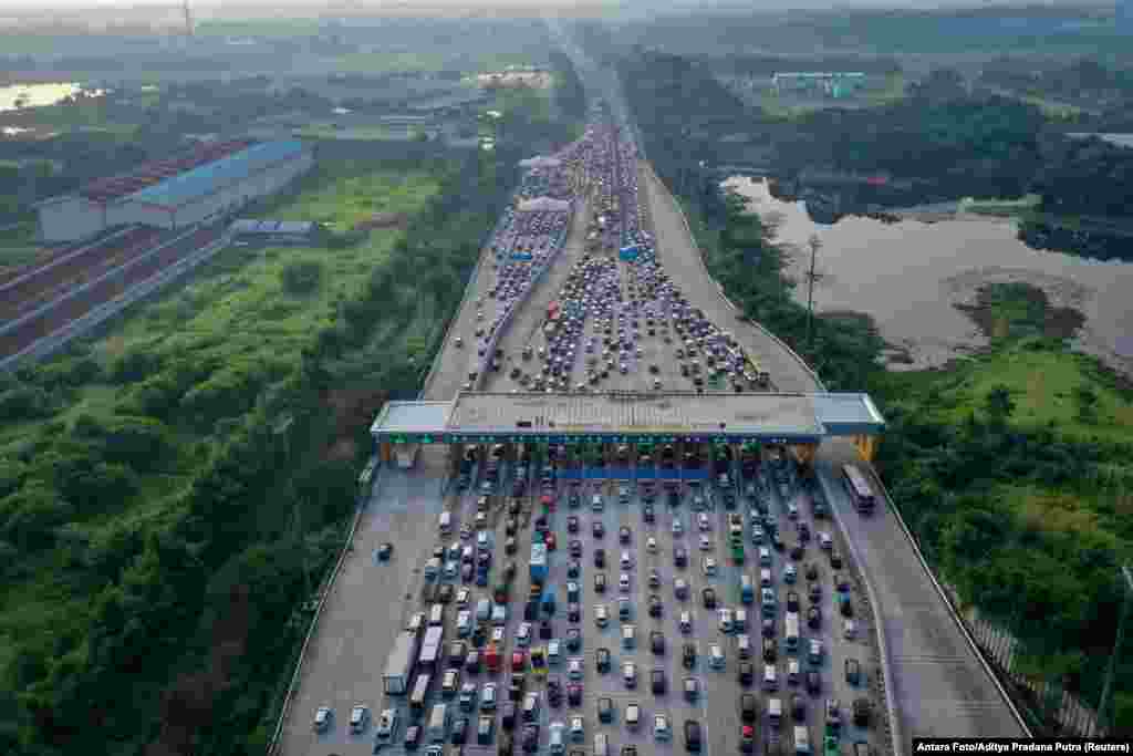 An aerial photo of a traffic jam at a toll booth of a highway, as Indonesian Muslims go back to their hometown to celebrate Eid al-Fitr, known locally as &#39;Mudik&#39; in Karawang, Indonesia.