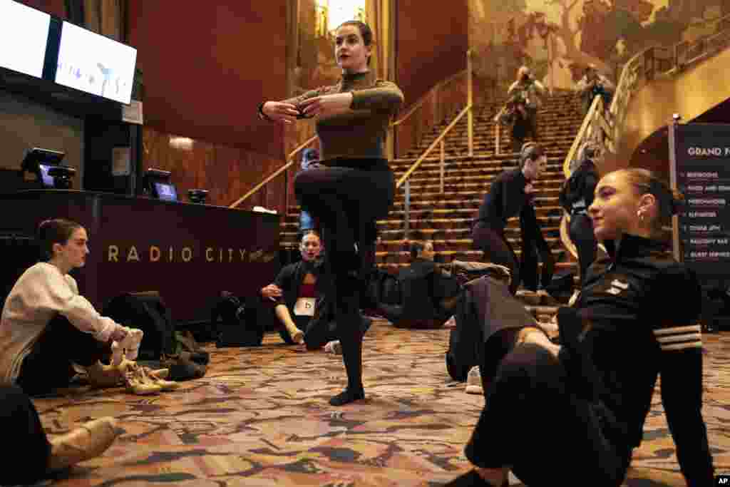Dancers stretch ahead of auditions for a spot on the Rockettes line for the &quot;2023 Christmas Spectacular Starring the Radio City Rockettes&quot; at Radio City Music Hall in New York.