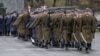 FILE - Soldiers are seen marching in a parade during a ceremony to mark the 25th anniversary of Poland joining NATO, on March 12, 2024 in Warsaw. 