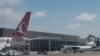 FILE - Airplanes are parked at Aden Adde International Airport in Mogadishu, Somalia, on Feb. 13, 2022.