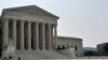 Security officers stand outside the U.S. Supreme Court building in Washington, DC. (Photo by Diaa Bekheet)