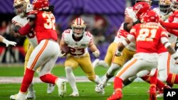 FILE - San Francisco 49ers running back Christian McCaffrey (23) runs the ball against the Kansas City Chiefs during the NFL Super Bowl football game in Las Vegas, Nevada, Feb. 11, 2024. The NFL's commissioner says the league could someday hold a Super Bowl outside the U.S.