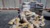 Aid destined for the Gaza Strip sits at the Kerem Shalom crossing in southern Israel, July 10, 2024. 