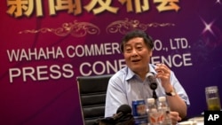 FILE - Zong Qinghou, once China's richest person, smokes as he speaks to journalists during a news conference in Beijing, China, July 17, 2013.