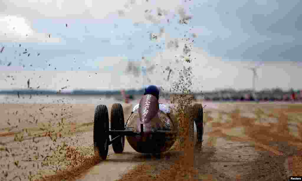 A motoring enthusiast takes part in the &#39;Race The Waves&#39; classic car and motorcycle meet at the beach in Bridlington, Britain.