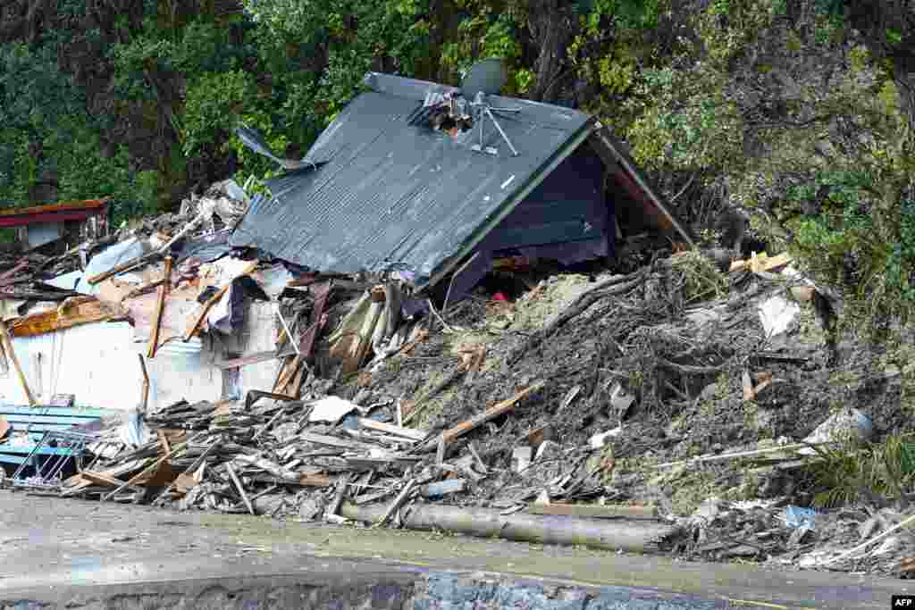 A general view of a damaged house after a storm battered Titirangi, a suburb of New Zealand&#39;s West Auckland area.