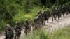 FILE - Japan Ground Self Defense Force members take part in a joint exercise with U.S. Marines on the northern island of Hokkaido, Japan, Aug. 16, 2017. Japan plans to hold joint military exercises with Germany and Spain on the island in June 2024.