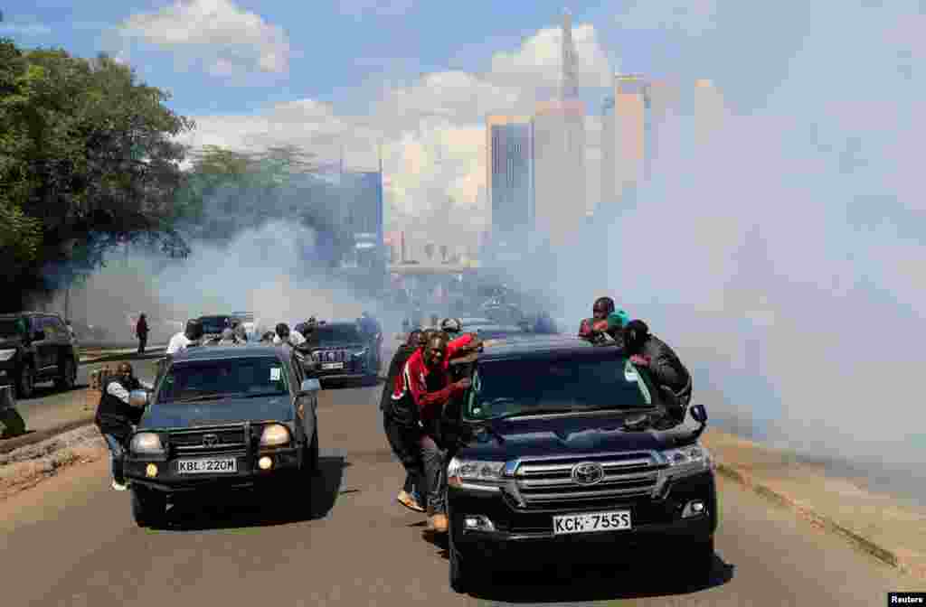 Riot police fire teargas to disperse supporters of Kenya&#39;s opposition leader Raila Odinga of the Azimio La Umoja (Declaration of Unity) One Kenya Alliance during a nationwide protest over cost of living and President William Ruto&#39;s government in Nairobi.