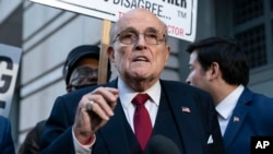 FILE - Former New York Mayor Rudy Giuliani speaks during a news conference outside the federal courthouse in Washington, Dec. 15, 2023. A judge on July 12, 2024, ended Giuliani's bankruptcy, allowing lawsuits against him to proceed. 