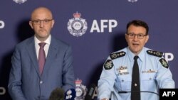 A supplied image shows ASIO Director-General Mike Burgess and AFP Commissioner Reece Kershaw addressing the media in Canberra, Australia, July 12, 2024. 