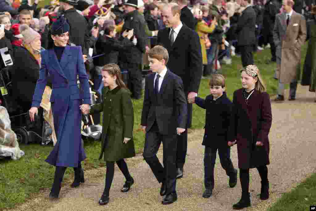 Britain&#39;s Kate, Princess of Wales, Princess Charlotte, Prince George, William, the Prince of Wales, Prince Louis and Mia Tindall arrive to attend the Christmas day service at St. Mary Magdalene Church in Sandringham in Norfolk, England.