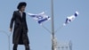 FILE- An ultra-Orthodox Jewish man reacts during a demonstration after the Supreme Court ruled the defense ministry could no longer grant blanket military conscription exemptions to Jewish seminary students, at Tel HaShomer recruitment base in Ramat Gan, Israel, Aug. 5, 2024. 