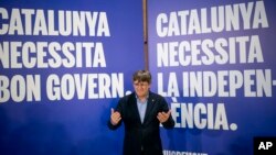 FILE - Former regional president Carles Puigdemont poses for a photo during a campaign rally in Argelers, France, May 8, 2024. 
