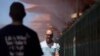 People walk through cooling misters along the Las Vegas Strip, June 4, 2024, in Las Vegas, Nevada. 