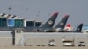 FILE - Planes that belong to the Royal Jordanian Airlines and other companies are parked at the Queen Alia International Airport in Amman, Jordan, Feb. 23, 2020. Jordan has asked on Aug. 5, 2024, all airlines landing at its airports to carry 45 minutes of reserve fuel.