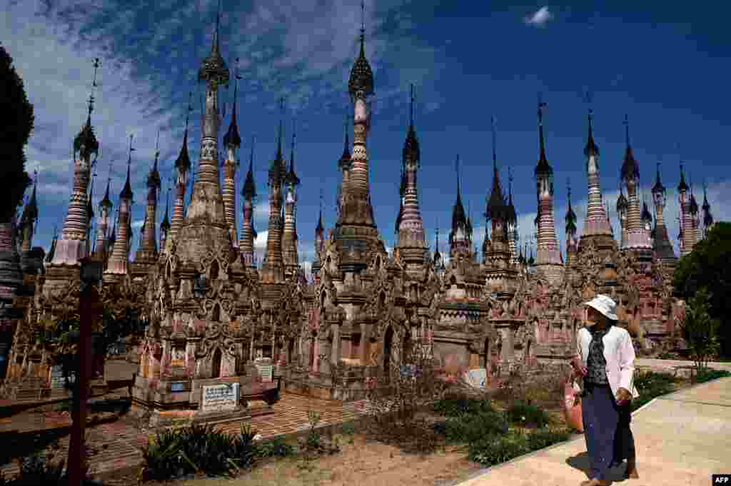 A visitor walks past stupas at the Kakku pagoda complex near Taunggyi township in Myanmar&#39;s southern Shan state.