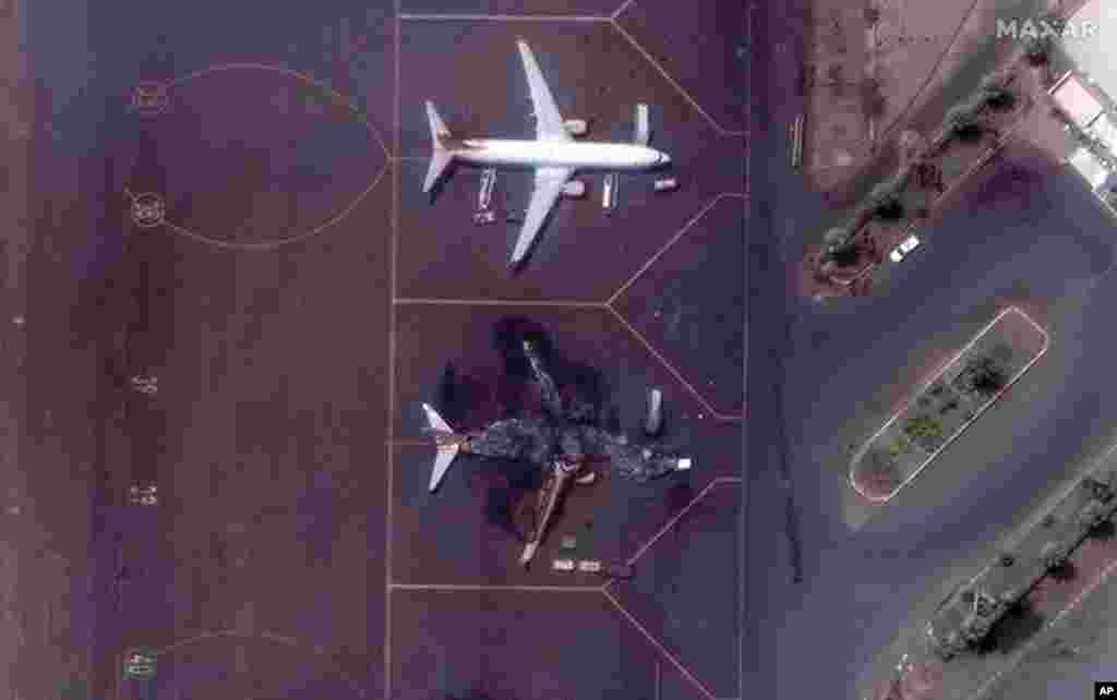 This satellite image provided by Maxar Technologies shows a destroyed Ukrainian airplane in Khartoum International Airport, Sudan, April 17, 2023.&nbsp;The Sudanese military and a powerful paramilitary group are battling for control of the chaos-stricken nation for a third day.