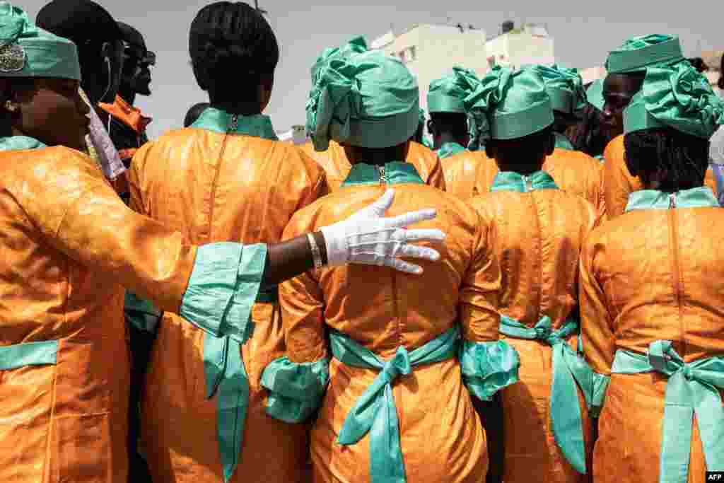 School girls gets ready to take part in celebrations for Senegals 63rd Independence Day in Dakar.