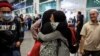 Malaysian national, evacuated from deadly violence in Bangladesh, is greeted by family members, as she arrives at Kuala Lumpur International Airport Terminal 2 in Sepang, July 23, 2024.