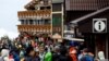 Climbers and visitors gather on the first day of the climbing season at Fuji Yoshidaguchi Trail (Yoshida Route) at the fifth station on the slopes of Mount Fuji, in Fujiyoshida, Yamanashi Prefecture, Japan, July 1, 2024. 