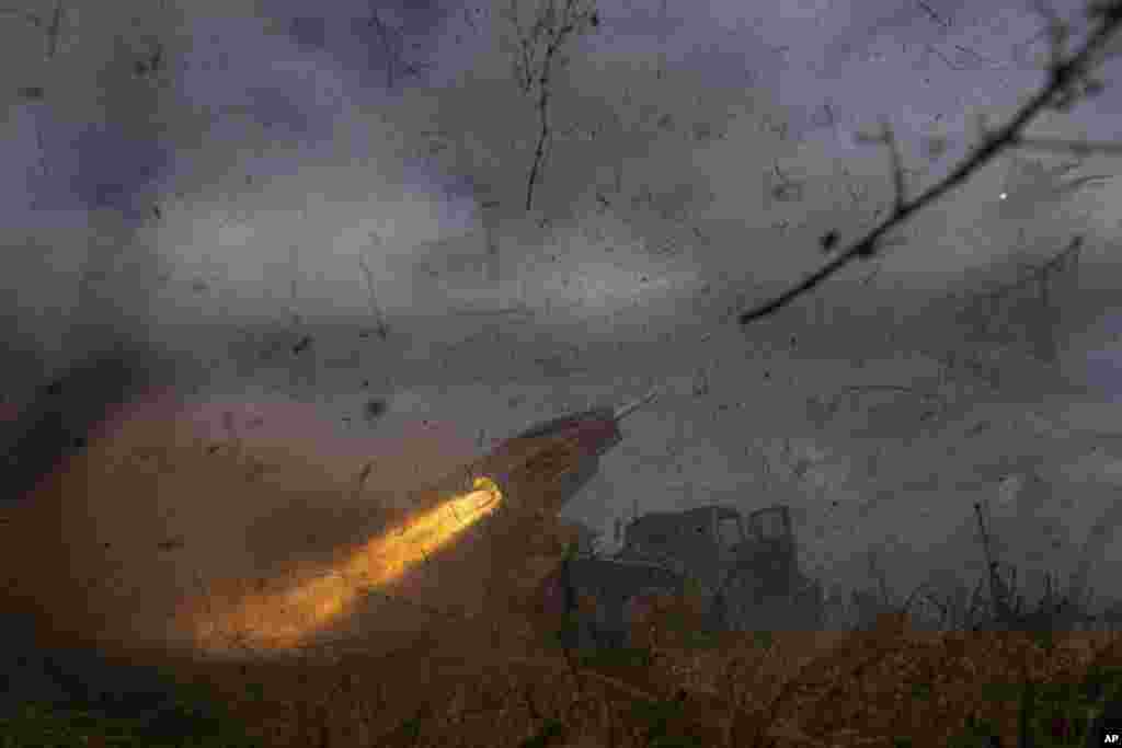 A Ukrainian MSLR BM-21 &quot;Grad&quot; of 95 Air Assault brigade fires towards Russian positions at the frontline near Kreminna.