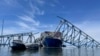 FILE - The fallen Francis Scott Key Bridge in Baltimore, Maryland, March 31, 2024. The cargo ship that caused the bridge collapse remained stuck amid the wreckage for almost two months.
