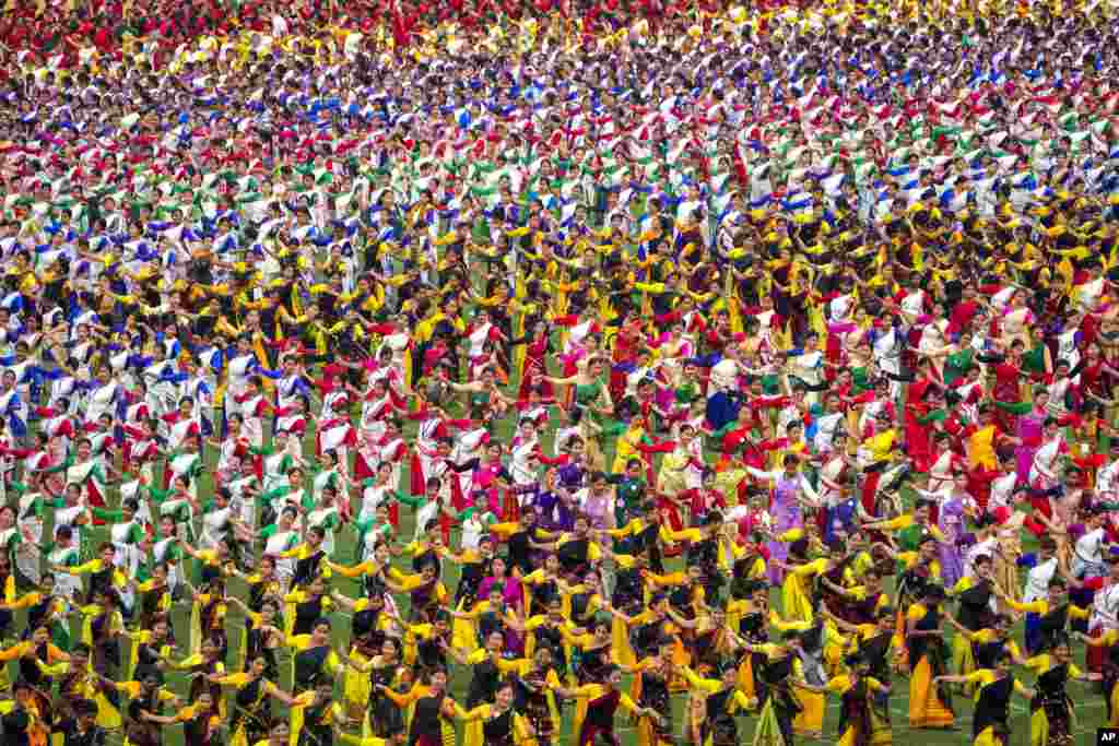 Assamese dancers in traditional attire practice Bihu dance ahead of an event in Guwahati, India.&nbsp;Around 11,000 Bihu dancers and musicians will perform together for Guinness World Record in the largest folk dance performance category on April 14.