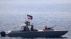 FILE - A boat of Iran's Islamic Revolutionary Guard Corps Navy operates in the Strait of Hormuz, June 20, 2022. The Revolutionary Guards' Navy reportedly intercepted a UAE-managed tanker engaged in fuel smuggling on July 21, 2024. (Photo by DVIDS / AFP)