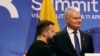 FILE - Ukraine's President Volodymyr Zelenskyy, left, stands with Lithuania's President Gitanas Nauseda after addressing a media conference in Vilnius, Lithuania, on April 11, 2024. 