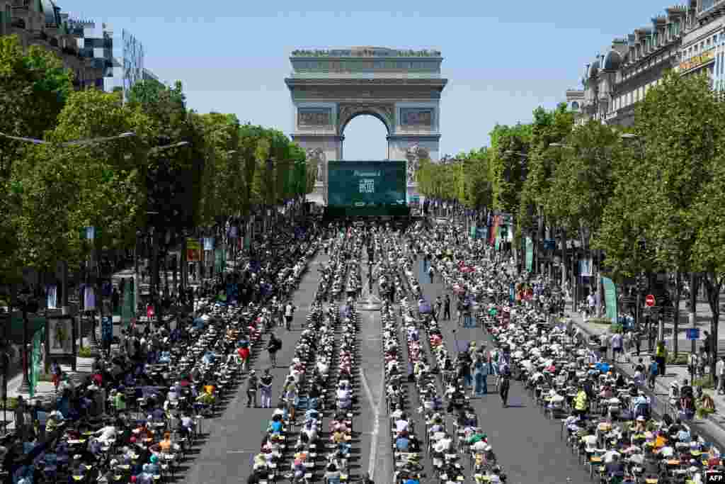The prestigious Champs-Elysees Avenue, is transformed into a giant classroom hosting participants, as they attempt to beat the record of the &quot;World&#39;s Biggest Dictation&quot; in Paris, France.