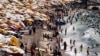 People crowd a public beach during a hot day amid a heatwave, in the Mediterranean city of Alexandria, Egypt, July 20, 2024. The next day was the hottest day ever recorded, according to data from the EU's Copernicus Climate Change Service. 
