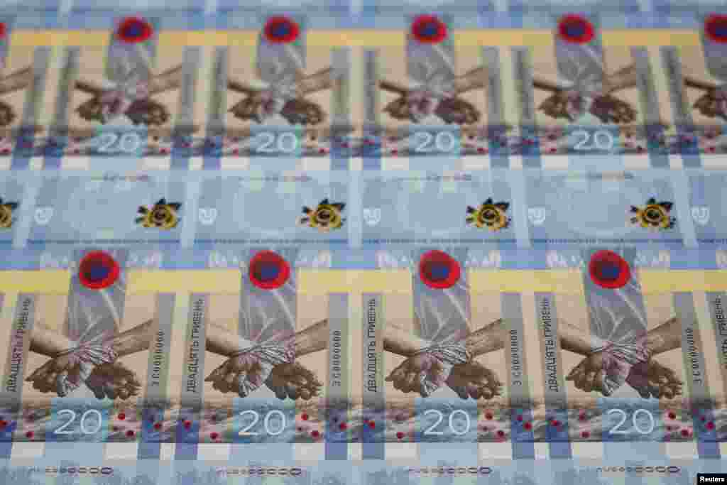 Banknotes dedicated to the first anniversary of Russia&#39;s invasion on Ukraine are seen during a presentation at the Ukrainian National Bank in Kyiv, Ukraine.