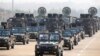 FILE - Military personnel participates in a parade on Armed Forces Day in Naypyitaw, Myanmar, March 27, 2021. 