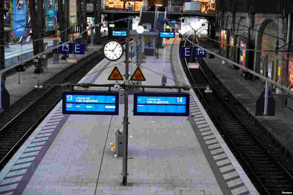 An electronic display reading &#39;no traffic of trains due to the strike&#39; is seen at the main railway station during a nationwide strike called by the German trade union Verdi over a wage dispute in Hamburg.