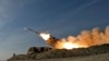 In this photo released by the Iranian Army on Jan. 19, 2024, a missile is launched during a military drill in southern Iran. 