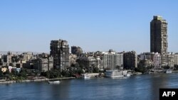 FILE - This picture taken on March 20, 2024 shows a view of residential buildings marking the skyline of the Nile river island of Manial al-Roda in Cairo.