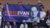 Fans at a New York Mets-New York Yankees baseball game at Citi Field display a banner in support of Wall Street Journal reporter Evan Gershkovich, who has been detained by authorities in Russia, June 13, 2023. (Vincent Carchietta-USA Today Sports)
