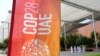 A sign for the COP28 U.N. Climate Summit is displayed in Dubai, United Arab Emirates, Nov. 29, 2023. 