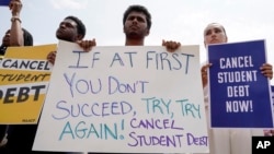 FILE - People in favor of canceling student debt protest outside the Supreme Court, June 30, 2023, in Washington. 