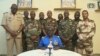 Niger army spokesman Colonel Major Amadou Adramane speaks during an appearance on national television, after President Mohamed Bazoum was held in the presidential palace, in Niamey, Niger, July 26, 2023, in this still image taken from video. (ORTN via Agence France-Presse)