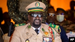 FILE - Guinean junta leader Colonel Mamady Doumbouya watches a military parade in Bamako, Mali, on Sept. 22, 2022. The draft of a new constitution released on July 29, 2024, would allow Doumbouya to participate in Guinea's next presidential election.