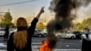 FILE - In this photo taken by an individual not employed by the Associated Press and obtained by the AP outside Iran, Iranians protest the death of 22-year-old Mahsa Amini after she was detained by the morality police, in Tehran, Oct. 1, 2022.