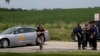 Policija blokira ulaz u park Makoketa posle pucnjave u kojoj je ubijeno troje ljudi, 22. jula 2022. 